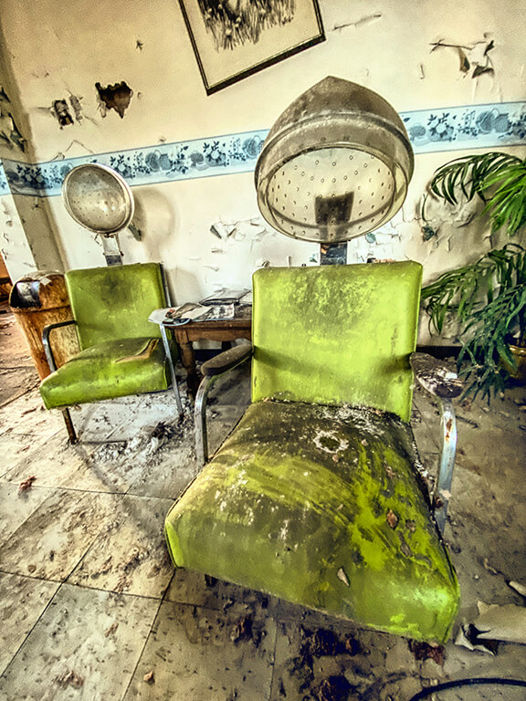 Neon green tattered beauty shop chair with heat hood