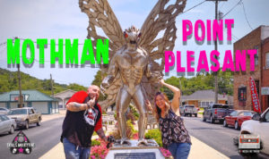 Beth and Nick standing in front of the Mothman Statue in Point Pleasant, WV