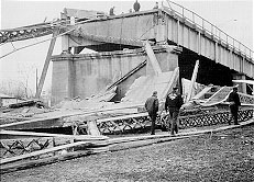 The Silver Bridge Collapse with people exploring the destruction.