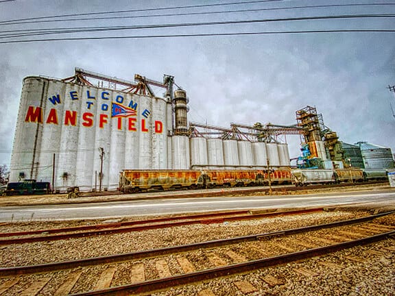 Standing next to railroad tracks taking a photo of the Mansfield Ohio Towers